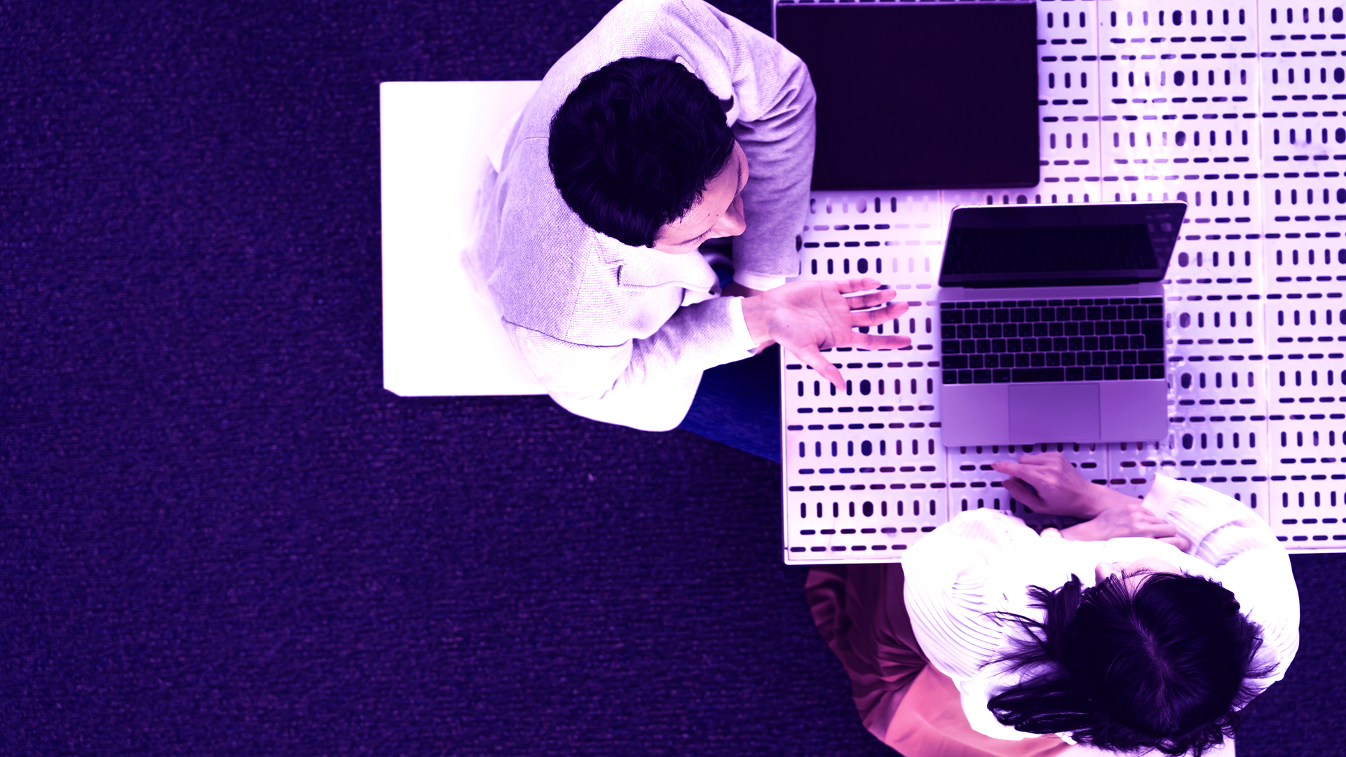 coworkers meeting with laptops