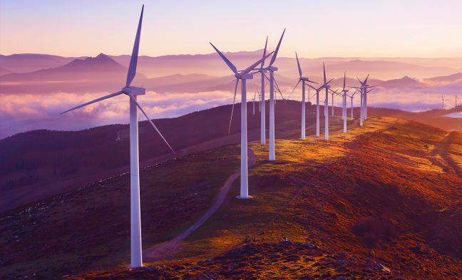 Wind turbines on mountain top - purple hue